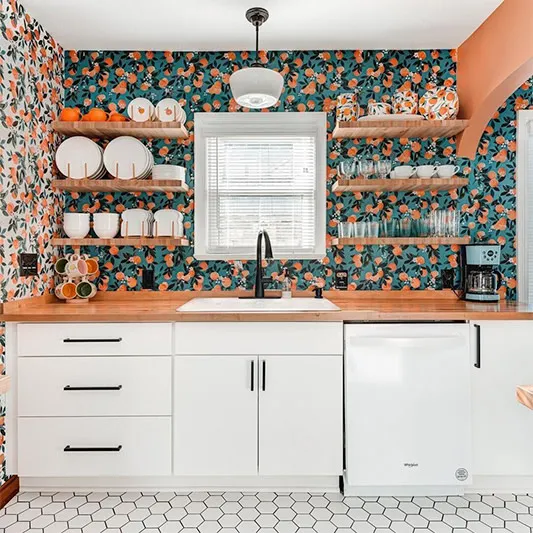 Wallpaper with oranges in a kitchen.